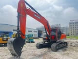 2023 Doosan DX300LC excavator, front three-quarter view