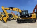 2023 Caterpillar 323DL crawler excavator, side profile view