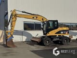 2008 Caterpillar M313D wheel excavator, side view