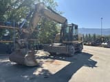 2014 Caterpillar M318D wheel excavator, front three-quarter view