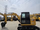 2023 Caterpillar 305.5E mini excavator, side view