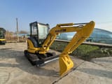 2024 Komatsu PC35MR mini excavator, front three-quarter view