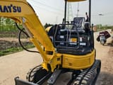2023 Komatsu 20MR mini excavator, rear three-quarter view