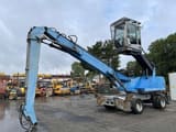 2011 Fuchs MHL335 material handler, side profile view