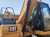2019 Caterpillar 320GC crawler excavator side view of cab and boom