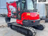 2023 Kubota KX057-4 mini excavator, front three-quarter view