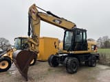 2013 Caterpillar M316D wheel excavator, front three-quarter view