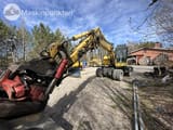 2007 Komatsu PW140-7 wheel excavator, front-side view with attachment