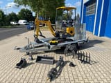 Berger Kraus BK1000JS mini excavator on trailer with attachments