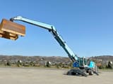 2011 Terex MHL360 material handler, side view with raised boom
