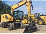 2024 Caterpillar M318-07 wheel excavator, front three-quarter view