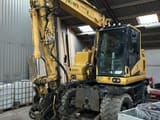 2018 Komatsu PW148-11 wheel excavator, front three-quarter view