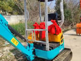 2023 Kubota U17 mini excavator, rear three-quarter view