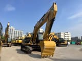 2024 Caterpillar 325DL crawler excavator, front three-quarter view
