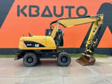 2011 Caterpillar M316D wheel excavator side view