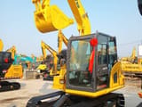 2025 Komatsu PC70 crawler excavator, front three-quarter view