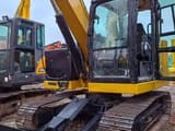 2025 Caterpillar 307 crawler excavator, front three-quarter view