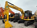 2023 Komatsu PC130 mini excavator, front three-quarter view