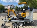 Berger Kraus BK1000JS mini excavator on a trailer, side view