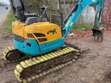 2024 Kubota U15 mini excavator, rear three-quarter view