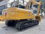 2024 Caterpillar 320GX crawler excavator rear three-quarter view