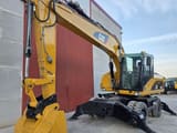 2007 Caterpillar M318D wheel excavator, front three-quarter view