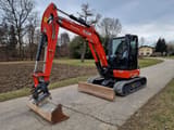 2023 Kubota KX060-5 mini excavator, side view