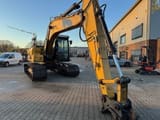 2010 Caterpillar 319DL crawler excavator, side view