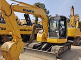 2024 Komatsu PC78US mini excavator, front three-quarter view