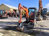 2021 Kubota U27-4 mini excavator, front three-quarter view