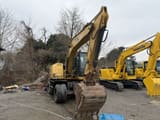 2018 Caterpillar M312D2 wheel excavator, front three-quarter view