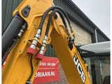 2023 JCB 19C-1 mini excavator boom and hydraulic lines close-up