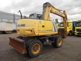 2011 New Holland WE150 wheel excavator, rear three-quarter view
