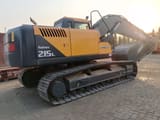 2025 Hyundai R215L crawler excavator, rear three-quarter view