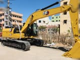 2026 Caterpillar 323D3 crawler excavator, side profile view
