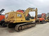 2024 Caterpillar 330 crawler excavator, rear three-quarter view