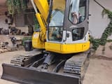 2023 Komatsu PC78US mini excavator, front three-quarter view