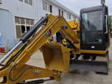 Caterpillar 305.5E mini excavator, front three-quarter view