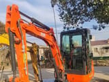 Kubota U-30 mini excavator, side view