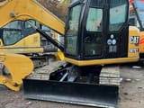 2024 Caterpillar 307E2 mini excavator, front three-quarter view