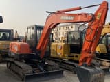 2023 Doosan DH55 mini excavator, side view