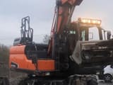 2019 Doosan DX140W-5 wheel excavator, front three-quarter view