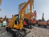 2024 Komatsu PC56 excavator, front three-quarter view