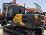2022 Volvo EC140 crawler excavator, rear three-quarter view