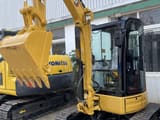 2024 Caterpillar 303.5E mini excavator, front three-quarter view