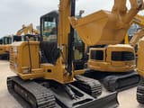 2022 Caterpillar 306E2 mini excavator, rear three-quarter view