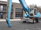 2017 Fuchs MHL340 wheel excavator, front three-quarter view