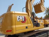 2023 Caterpillar 320GC crawler excavator, rear three-quarter view