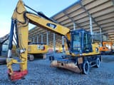 2014 Caterpillar M318D MH wheel excavator, side view