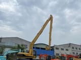 2023 Caterpillar 320BL amphibious excavator, rear three-quarter view